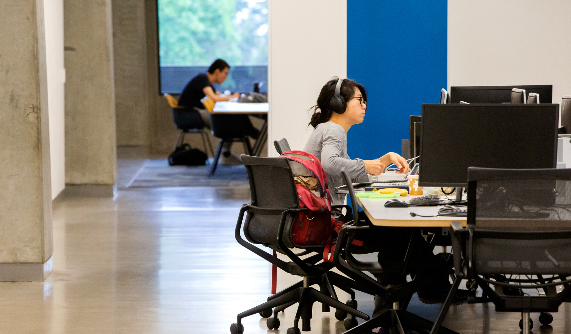 student at a bank of computers