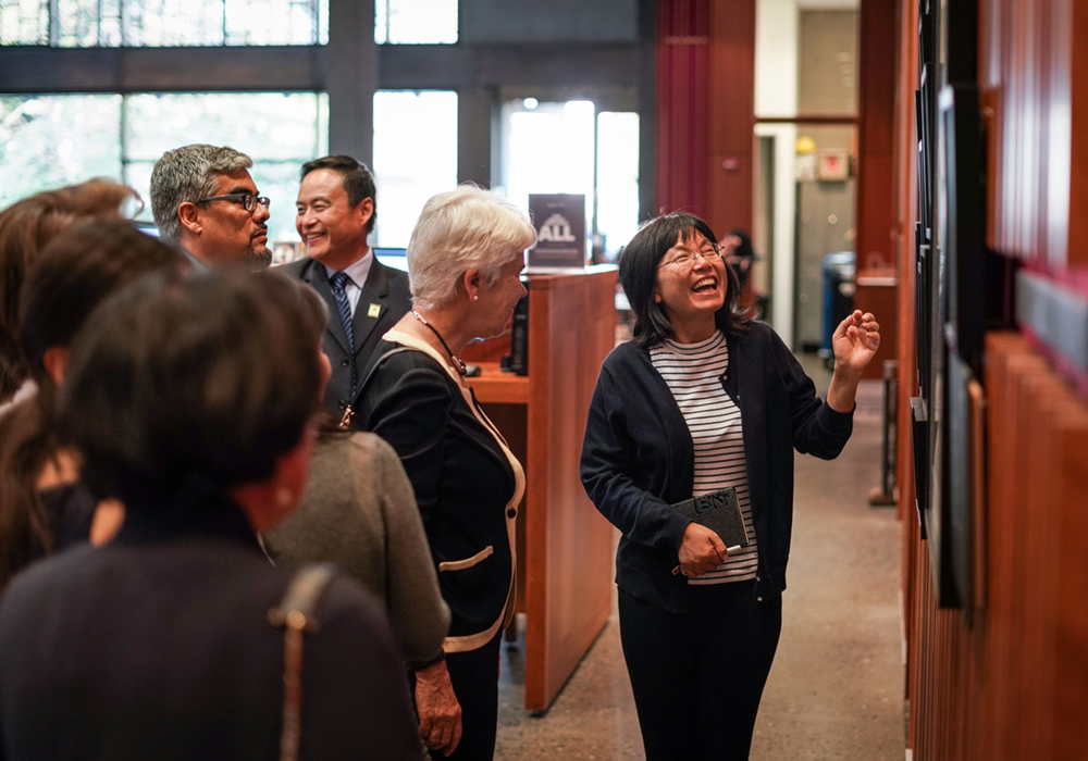 Librarian shows an exhibit to visitors
