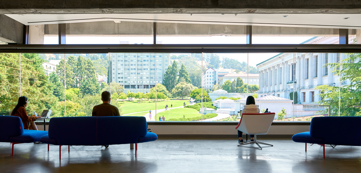 Students work in Moffitt Library overlooking Memorial Glade