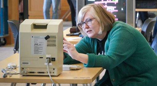 a teacher tries to fix an old macintosh computer