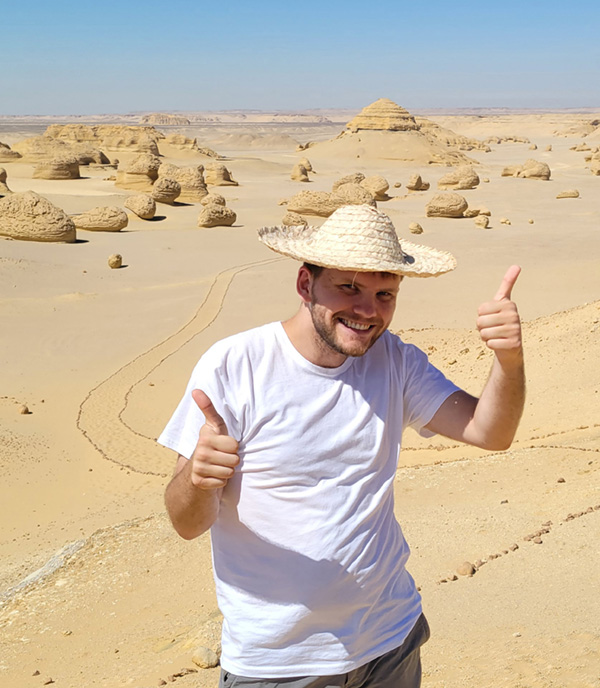 photo of sieving showing two thumbs up in egypt