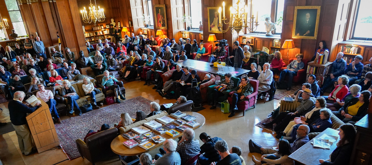 Morrison Library is full of patrons listening to Lunch Poems 