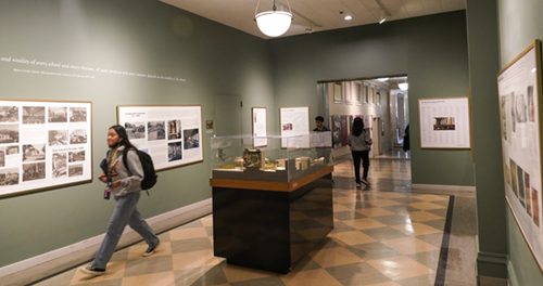 students walk through the history room