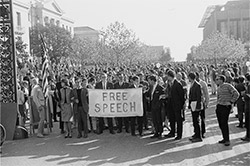 Marchers coming through Sather Gate with Free Speech sign to the UC Regents' meeting in University. Photoa courtesy of The Bancroft Library University Archives