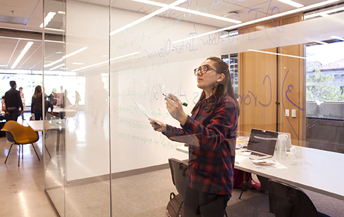 Student using eraseable glass