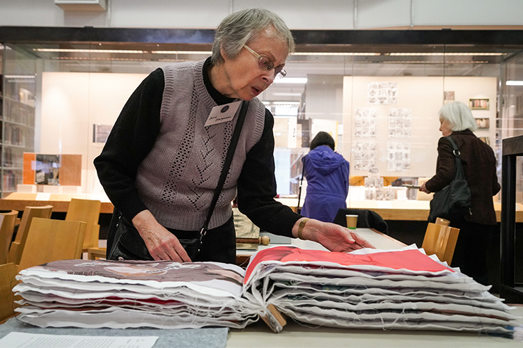 Ann Jorgensen looks at a book