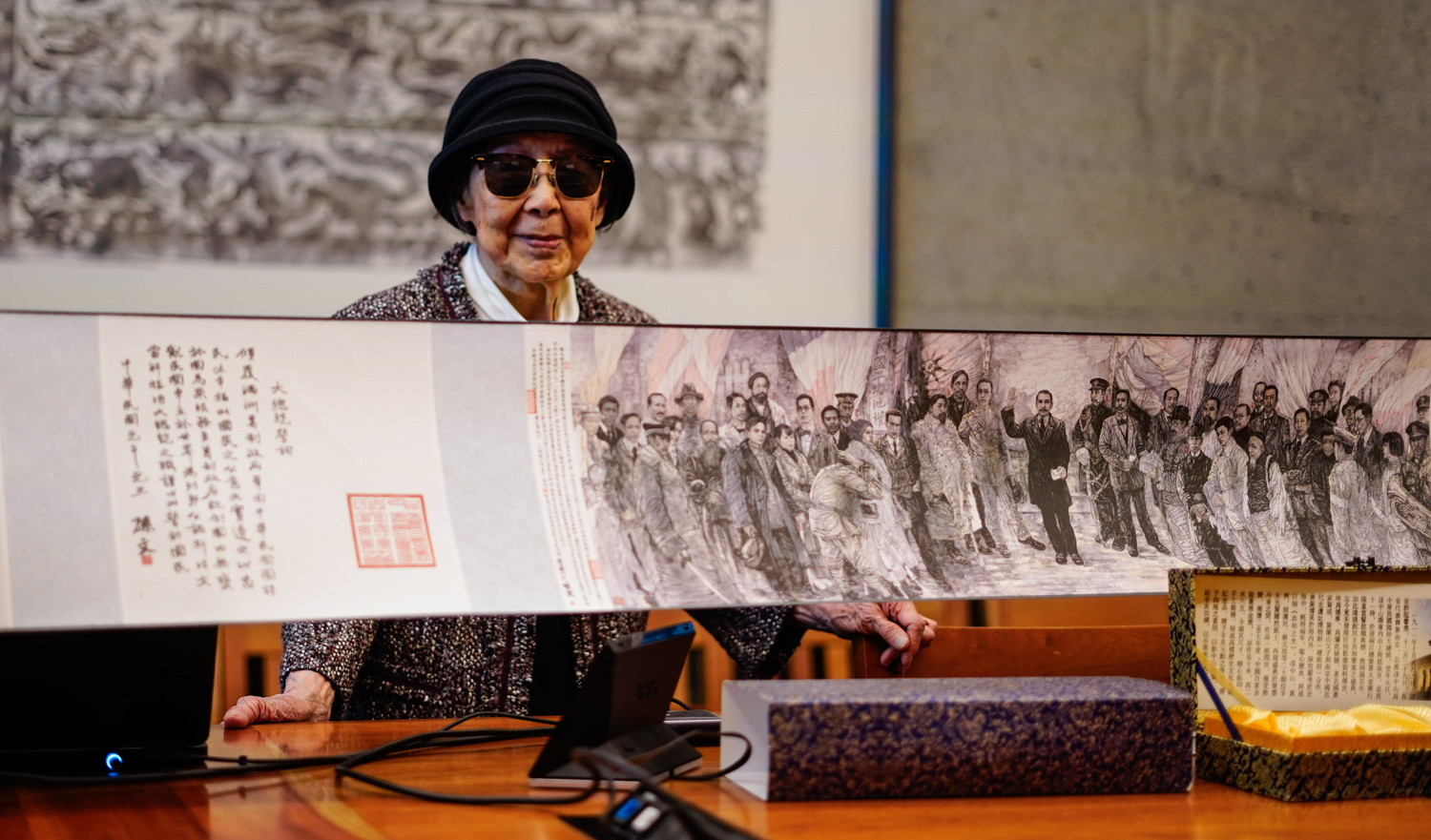 Pearl Sun Lin with a donation item