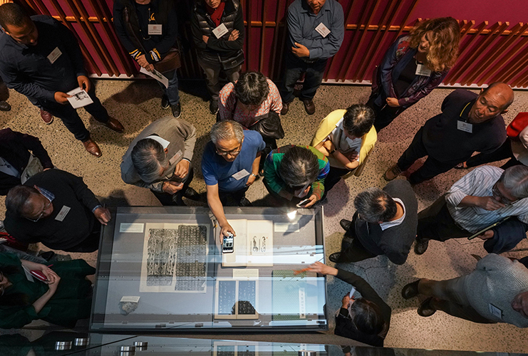 Visitors look at exhibit items