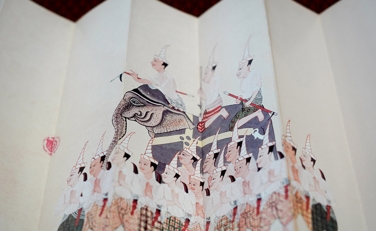 A book with accordion folds and an elephant illustration
