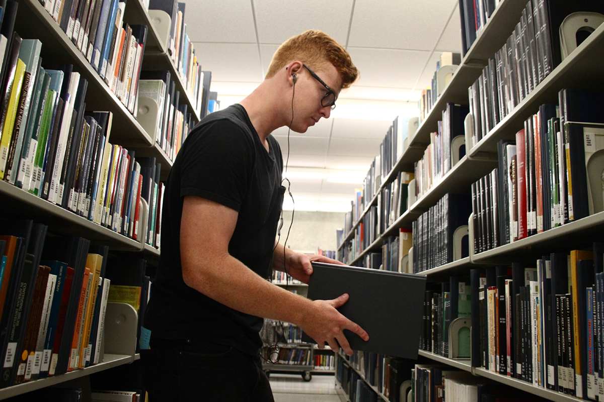 Student worker in stacks