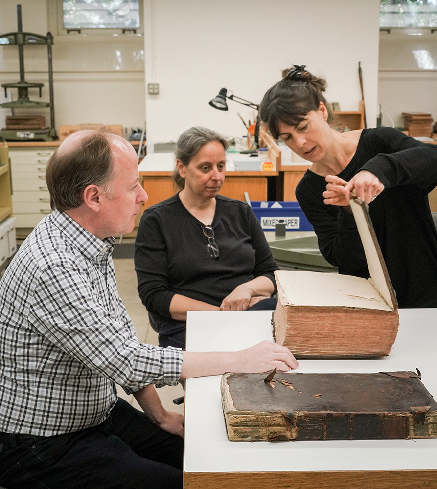 Conservationists and a curator discuss a book