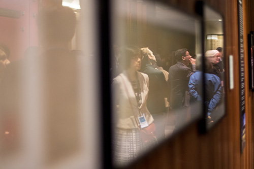 Participants look at exhibit