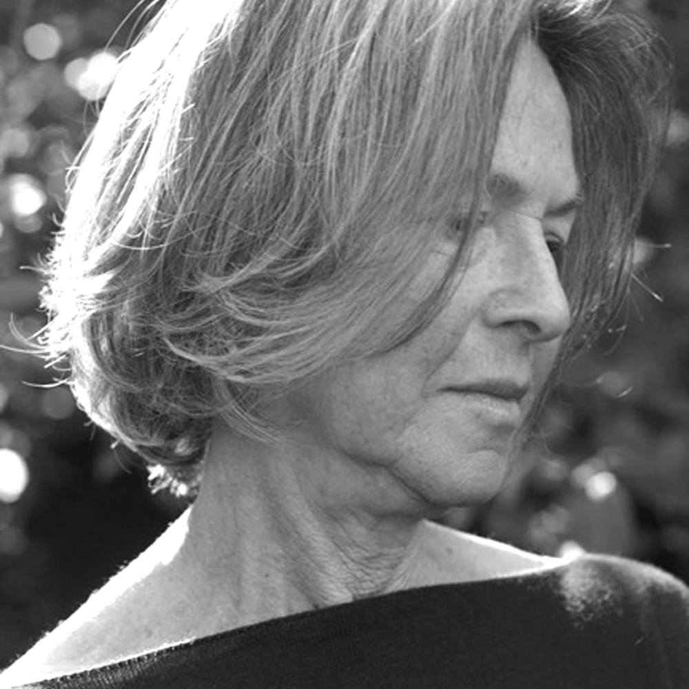 Gluck in a black and white photo, looking away from the camera