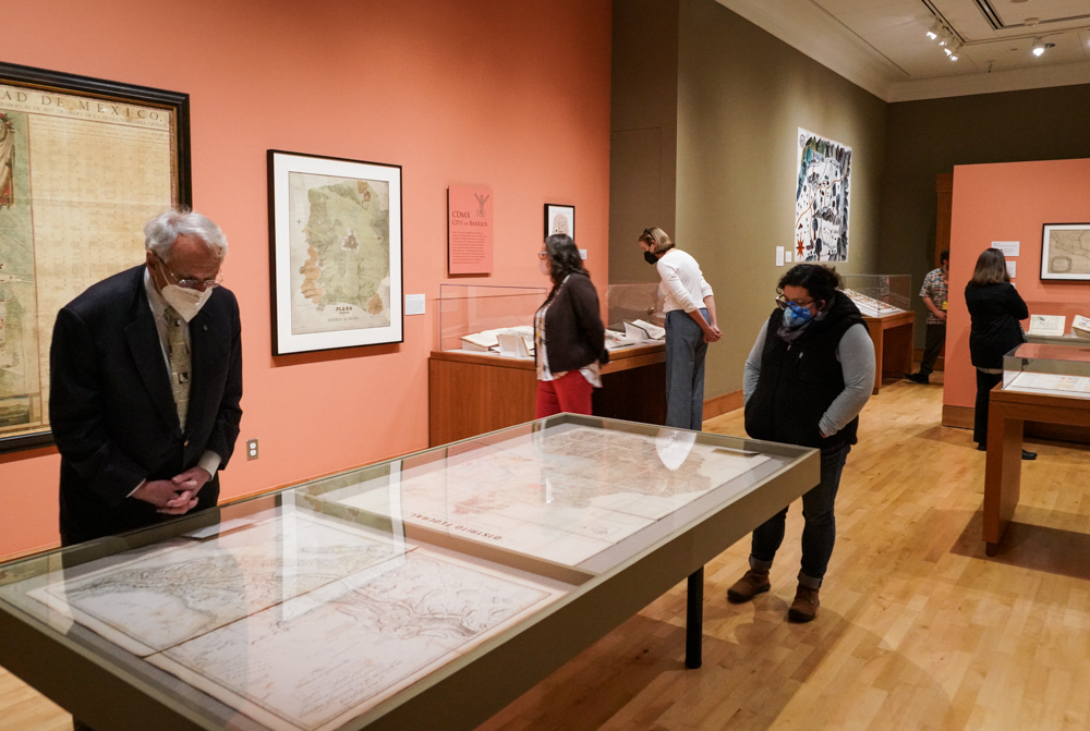 visitors look at maps in the bancroft gallery