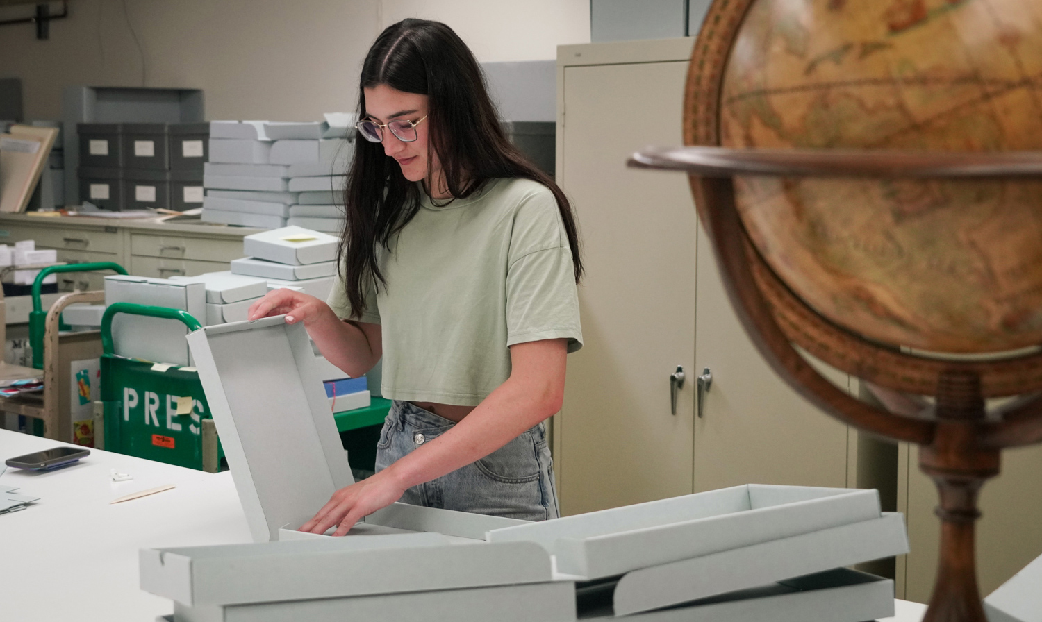 student folding boxes